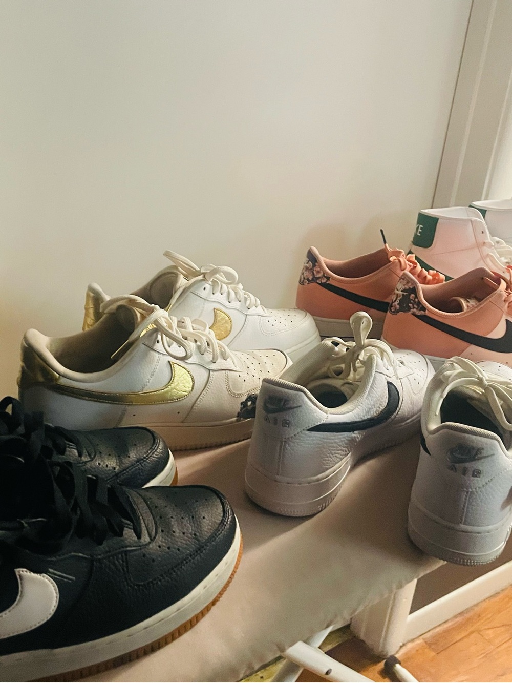 Nike Kids White Sneakers with Gold Swoosh